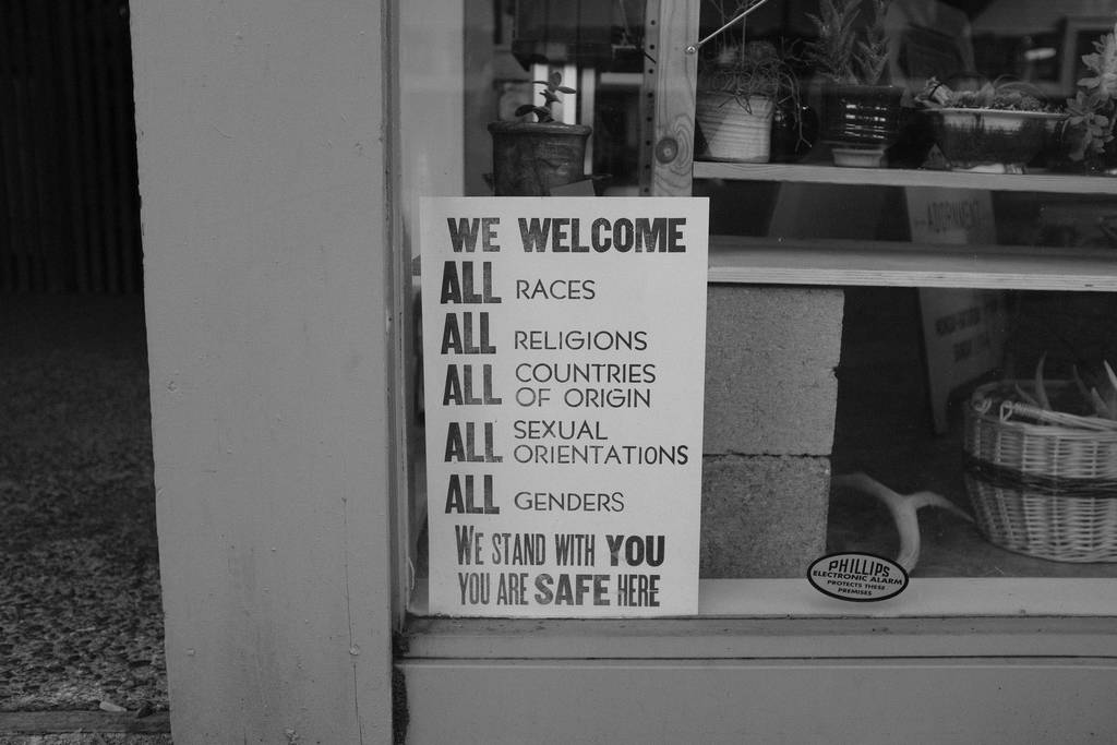 Sign reading, "We welcome all races, all religions, all countries of origin, all sexual orientations, all genders. We stand with you. You are safe here.